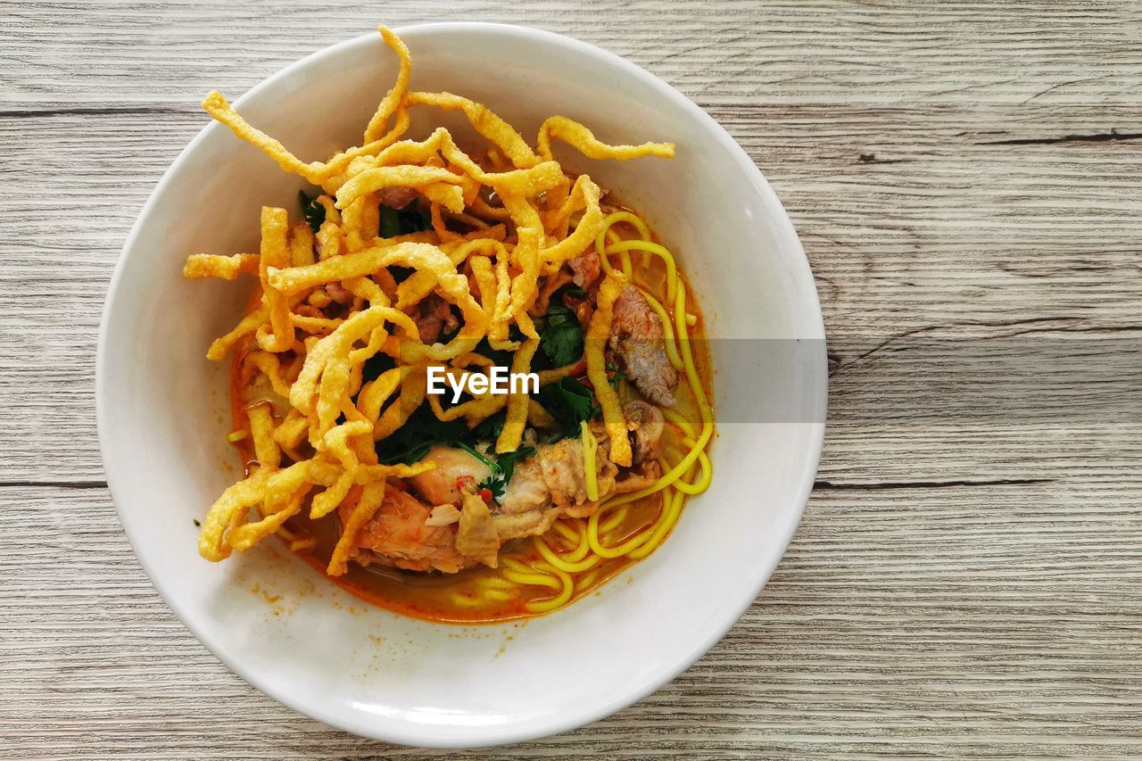 High angle view of thai northern style curry noodles  served in bowl 