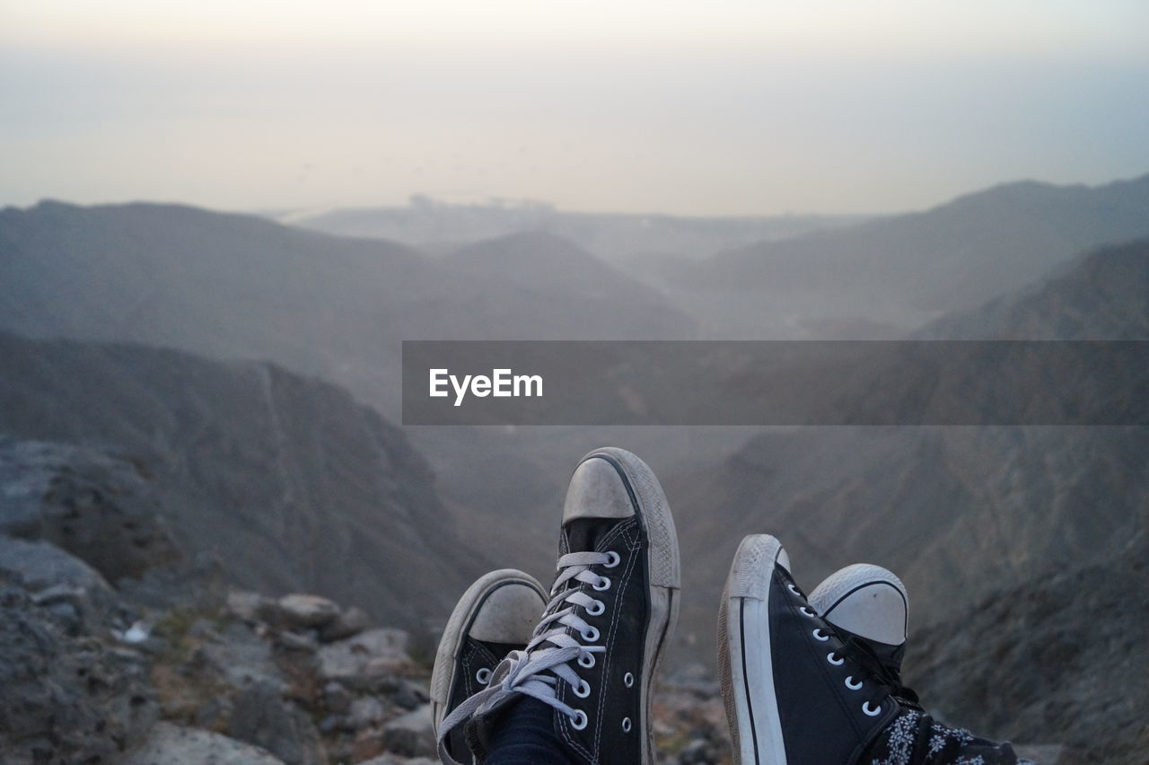 Low section of people relaxing on mountain