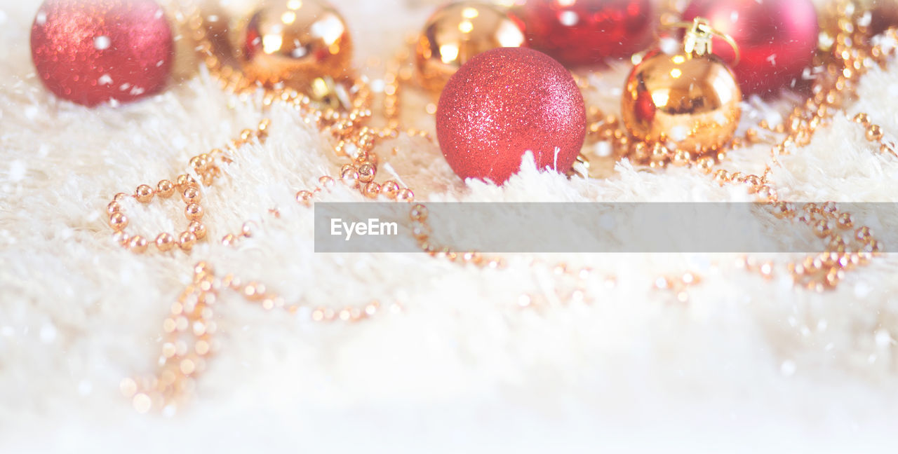 Close-up of christmas ornaments on fur