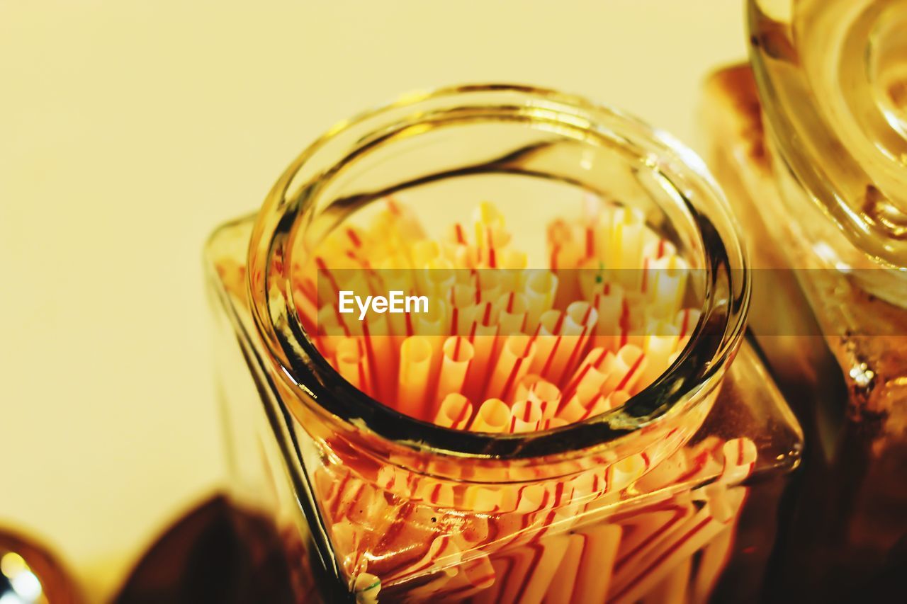 CLOSE-UP OF DRINK IN JAR ON TABLE