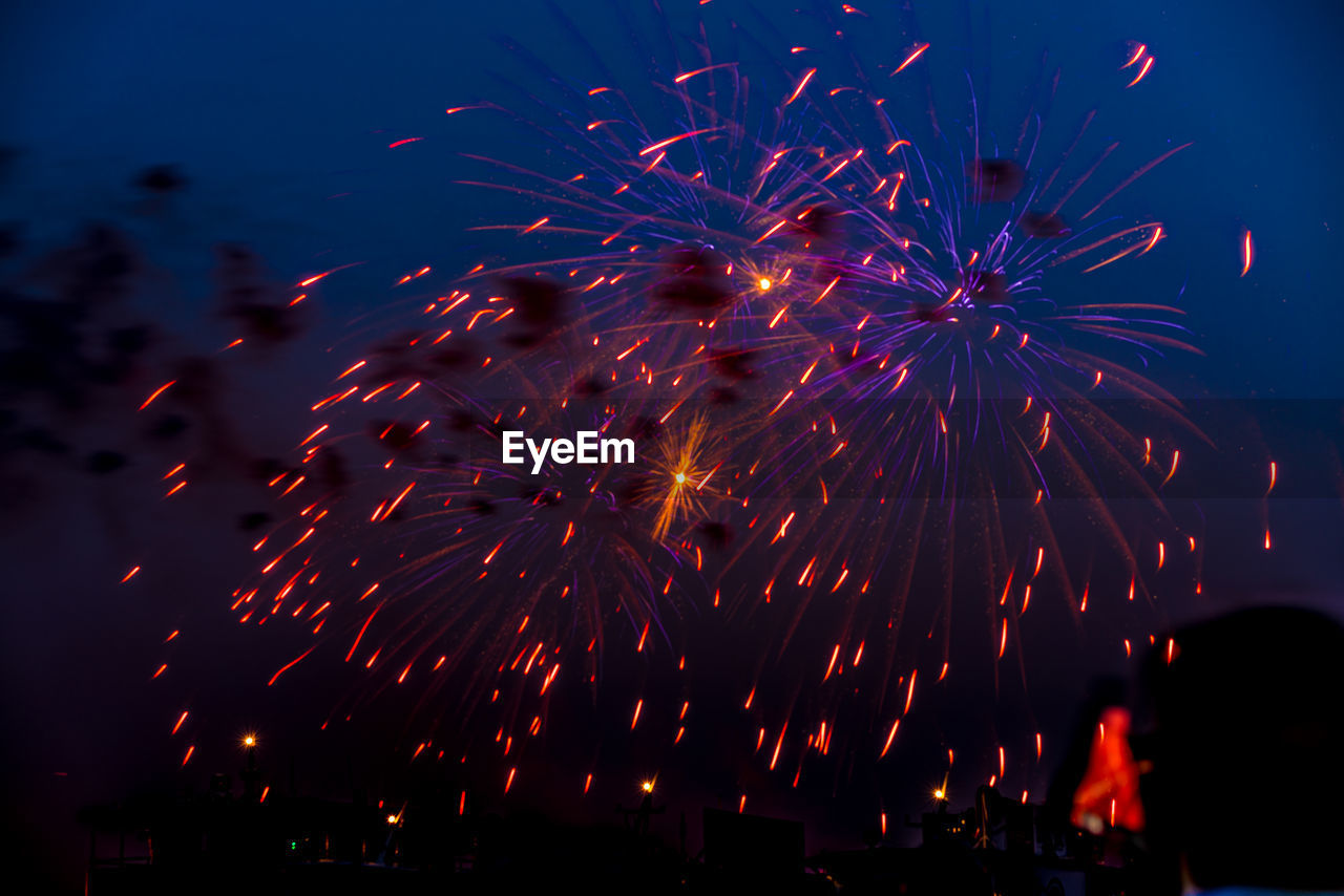 Low angle view of sky illumed with fire crackers