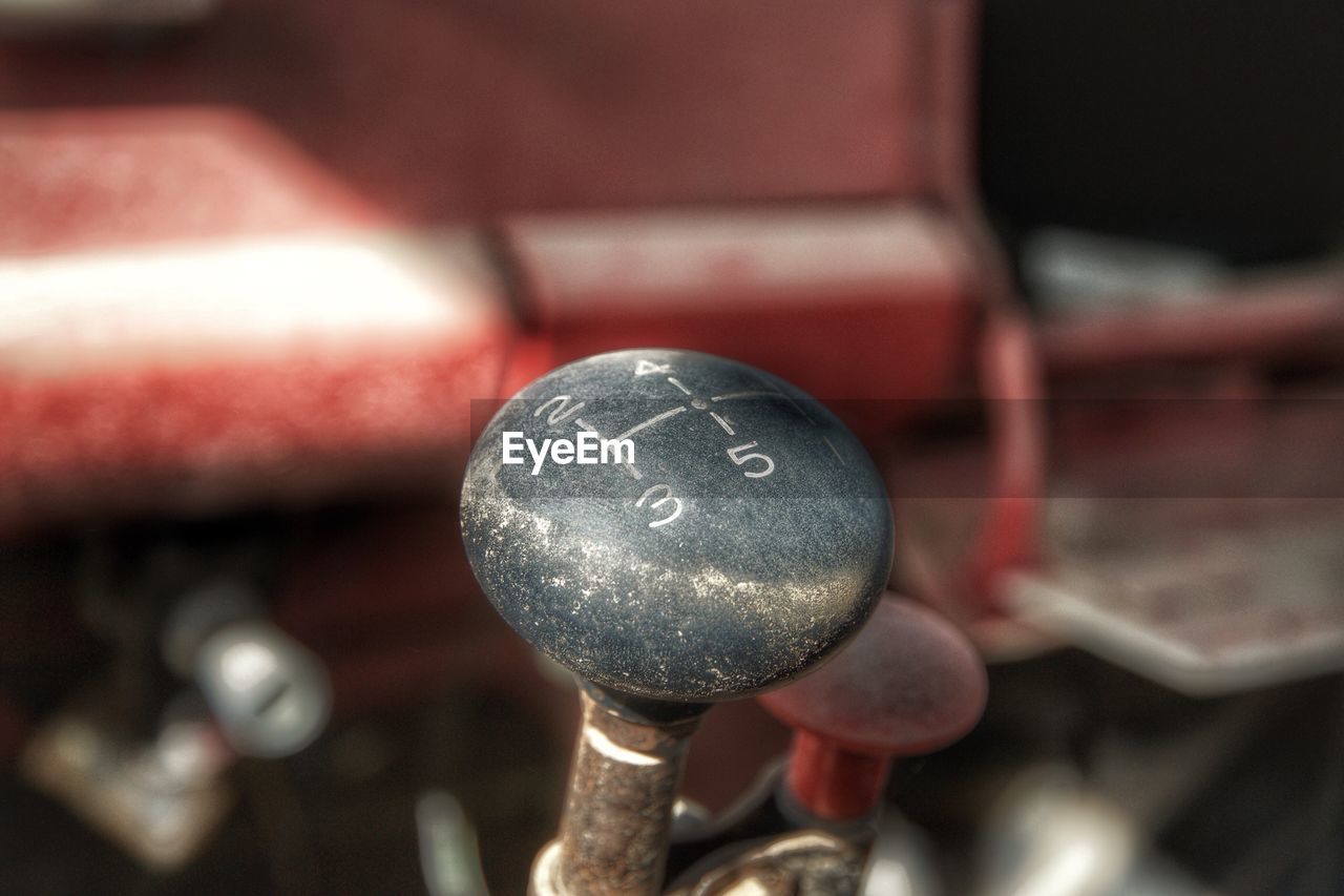 CLOSE-UP OF LIGHT BULB ON METAL