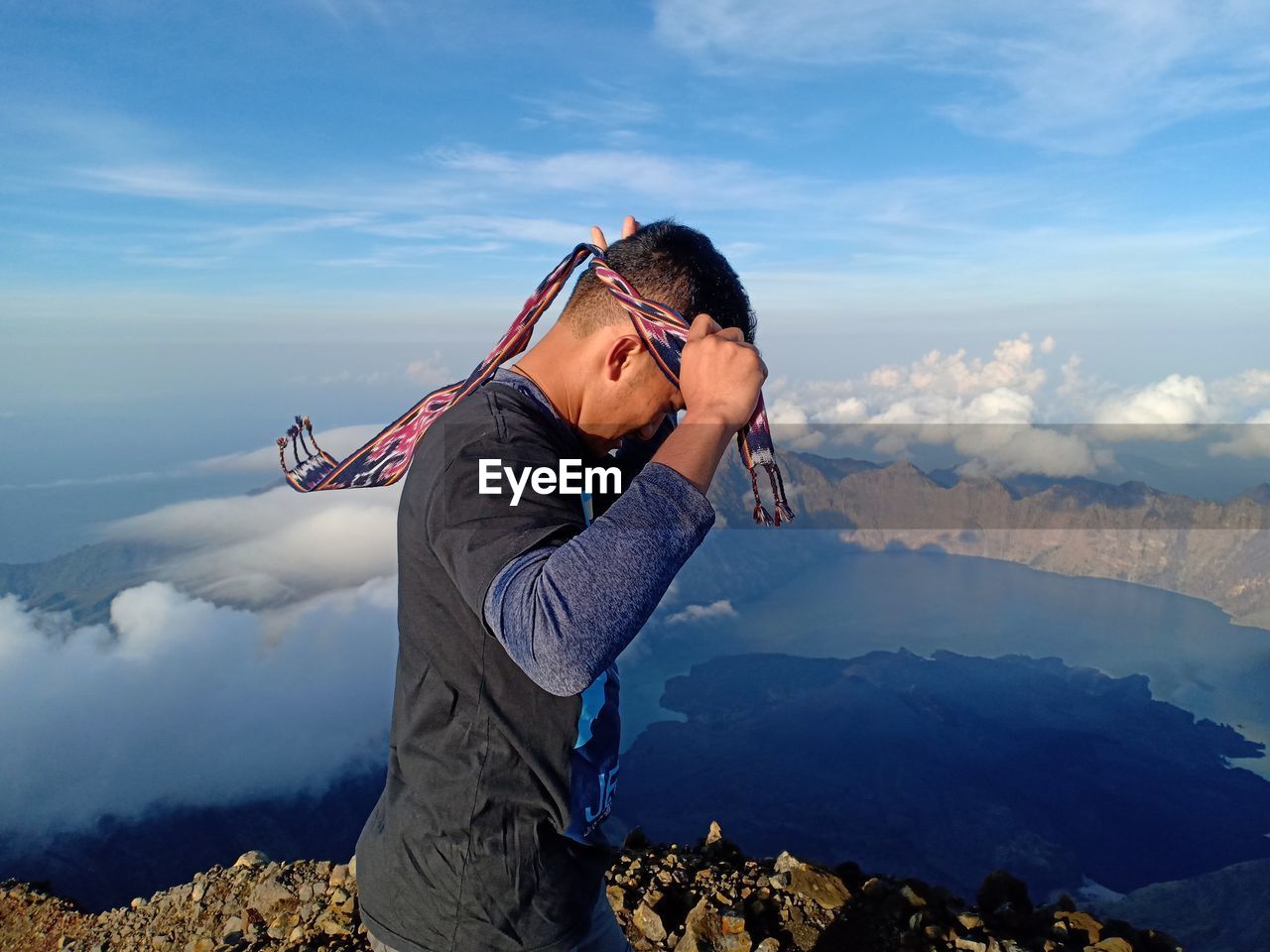 Side view of senior man against mountains