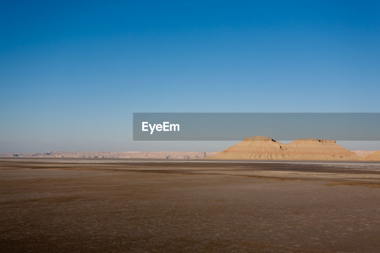 scenic view of beach against clear sky