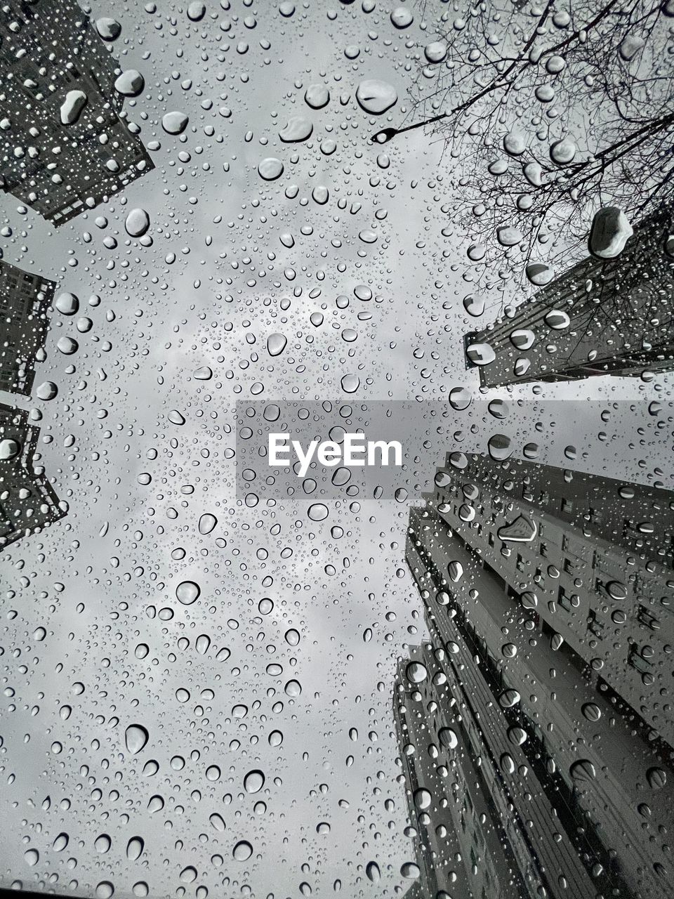 Full frame shot of wet glass window during rainy season