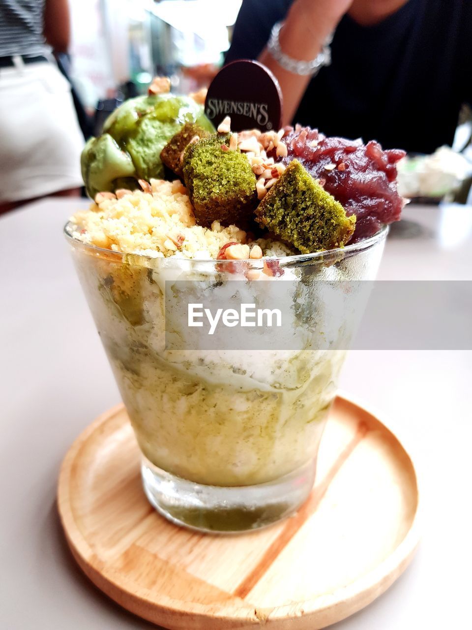 CLOSE-UP OF ICE CREAM ON GLASS