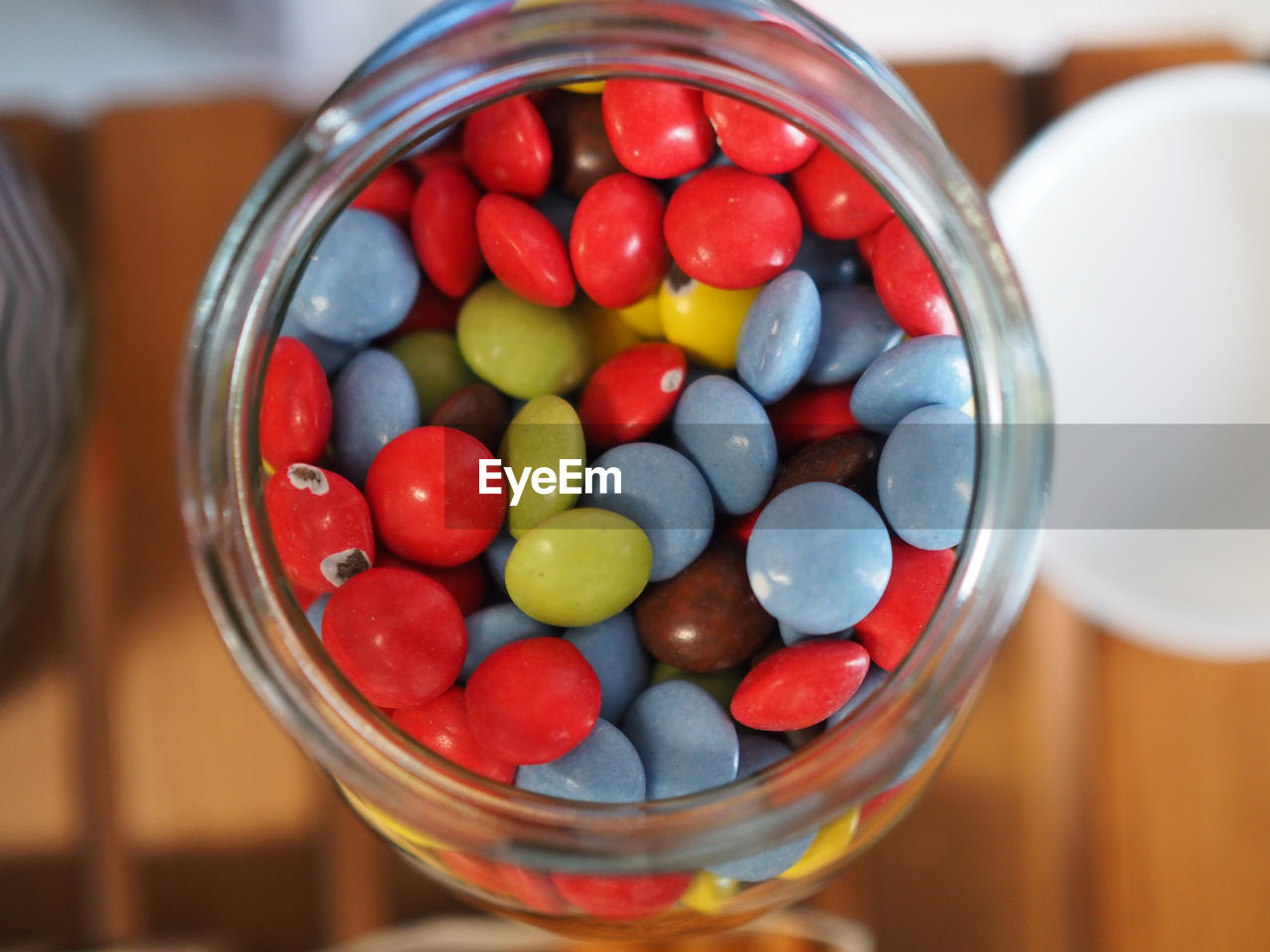 Close-up of candy in jar on table