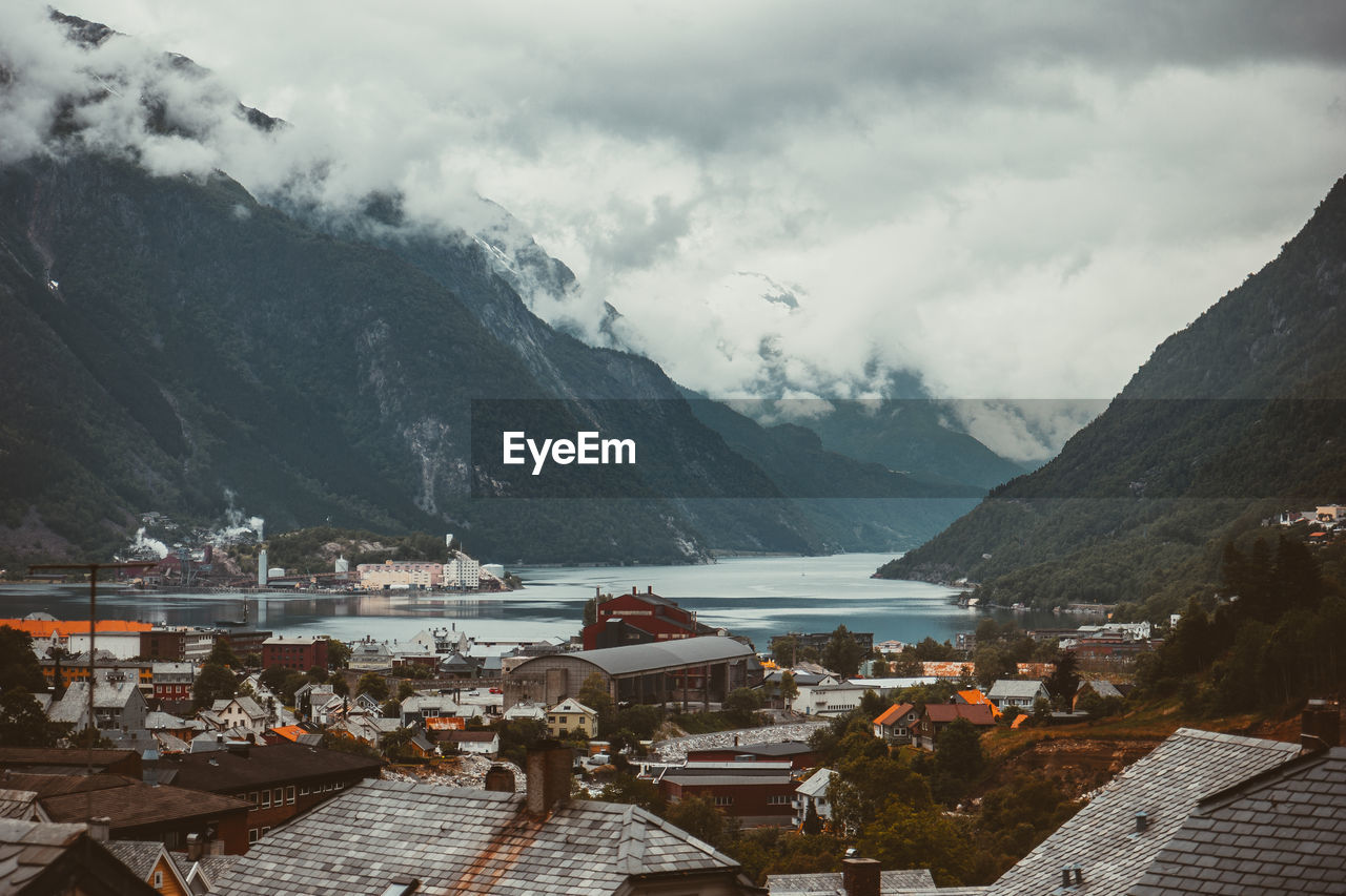 Panoramic view of lake and buildings against sky