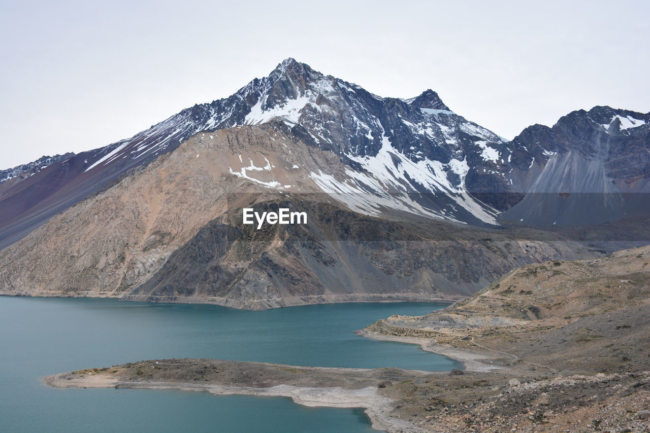 SCENIC VIEW OF MOUNTAINS AND LAKE