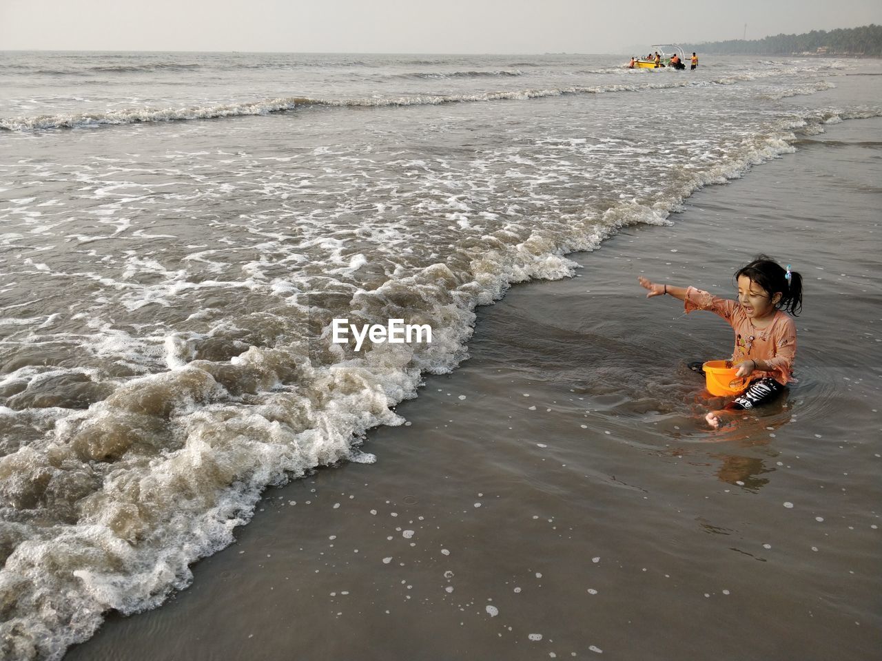 PEOPLE ENJOYING AT BEACH