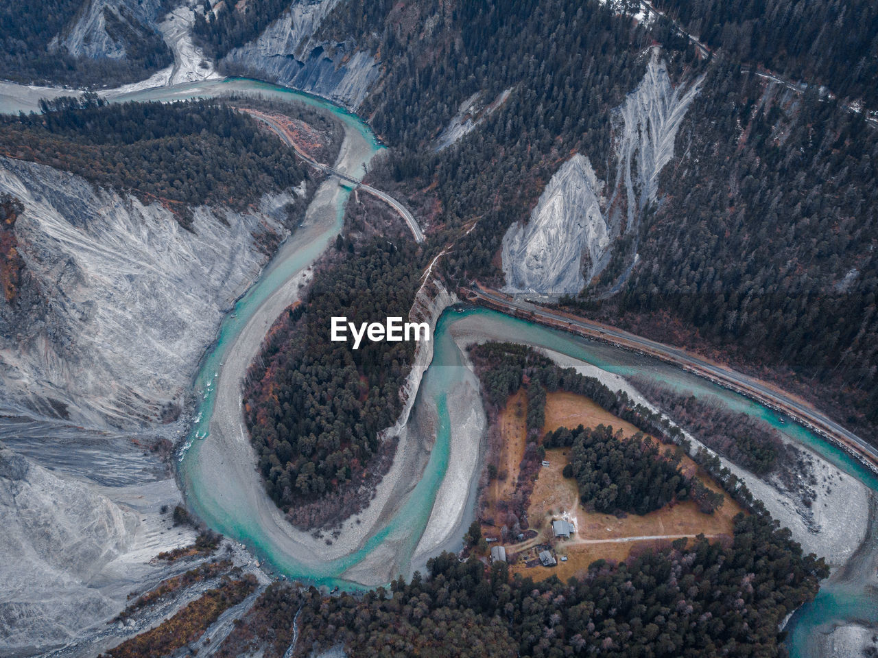 Aerial view of river flowing amidst valley