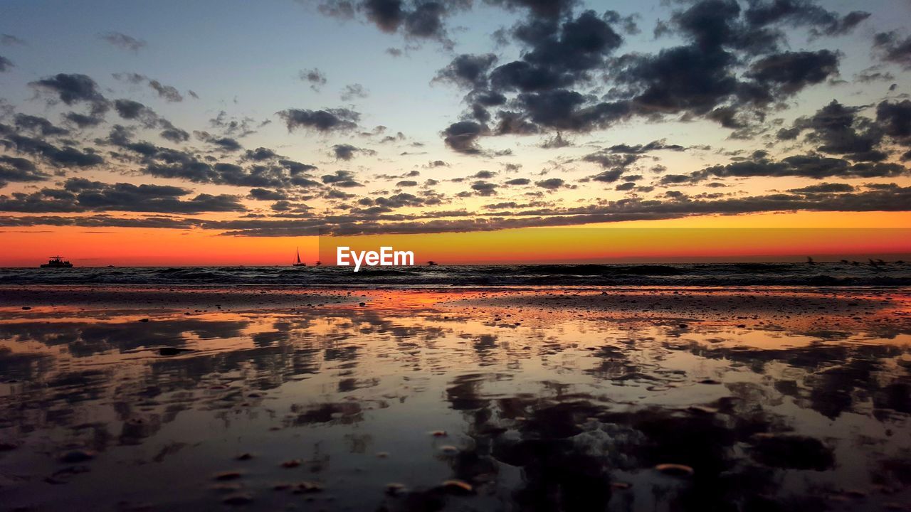 SCENIC VIEW OF SEA DURING SUNSET