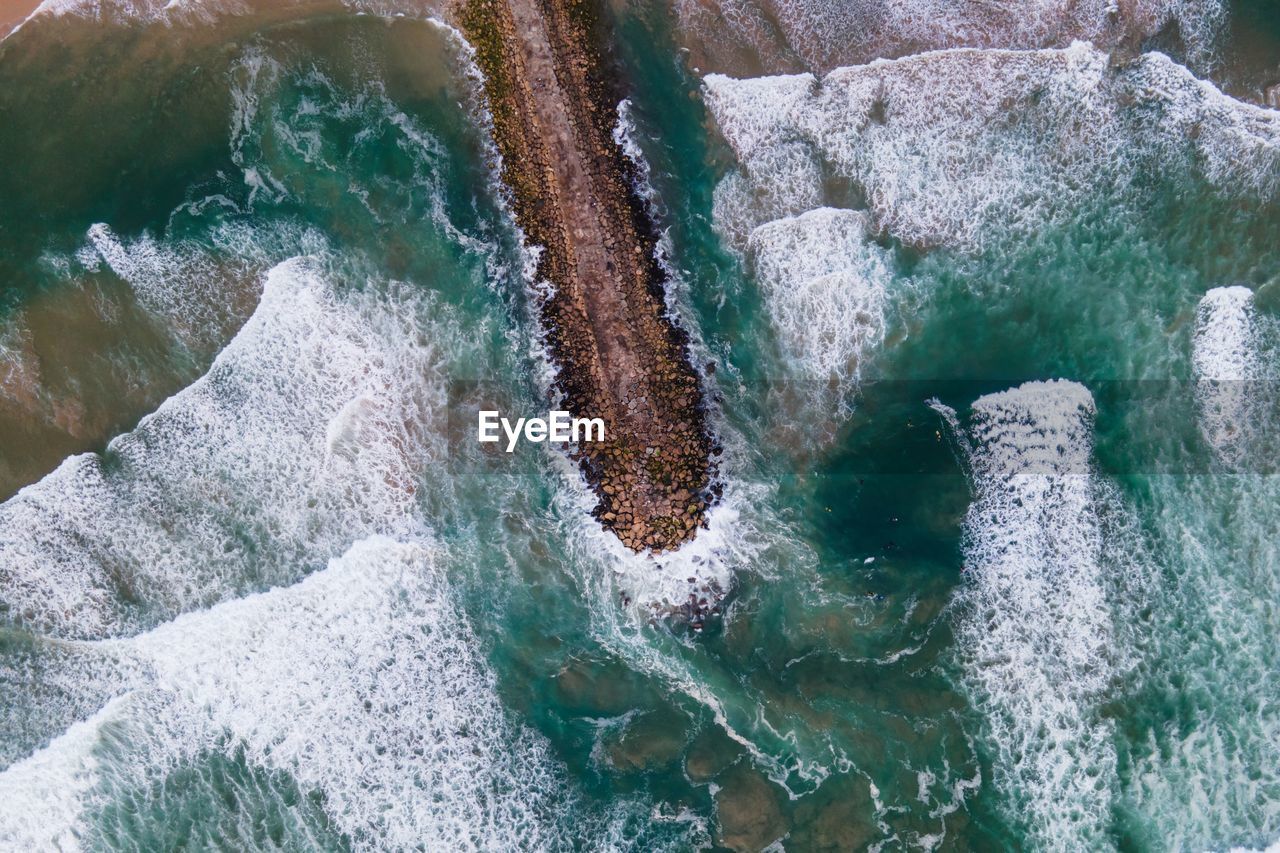 Aerial view of groyne in sea