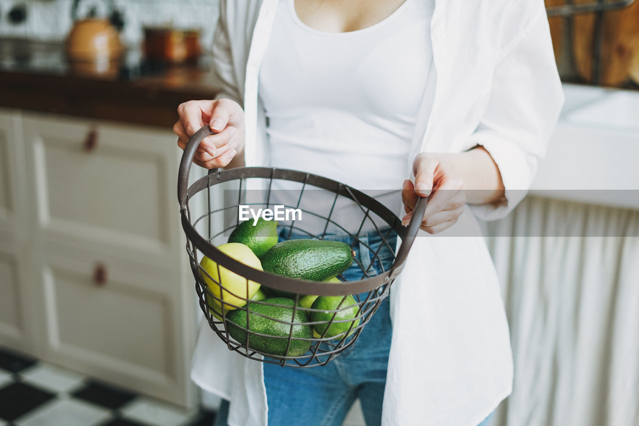 Midsection of woman holding food