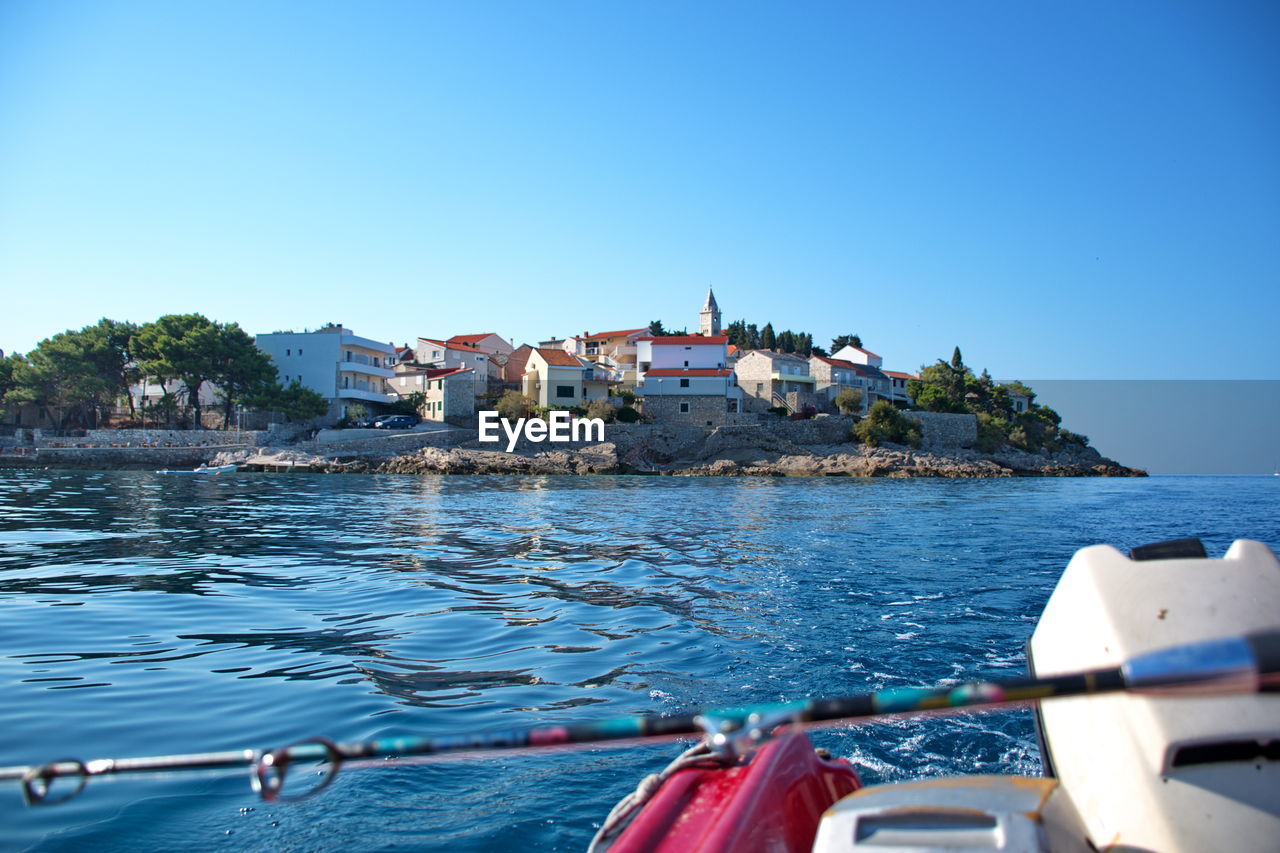 Cityscape of primosten in adriatic sea from a motor boat