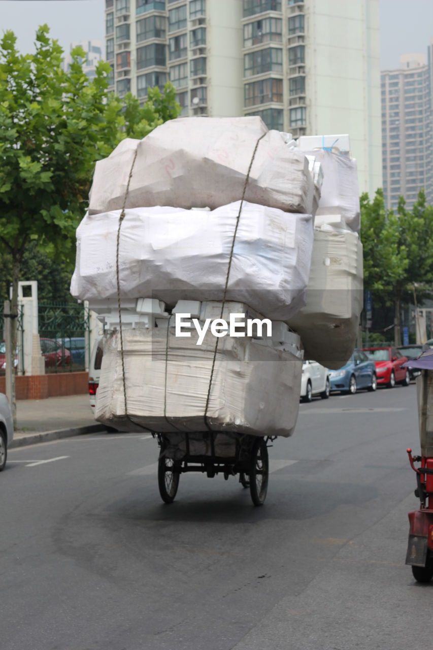 Stack of polystyrene stacks loaded on rickshaw
