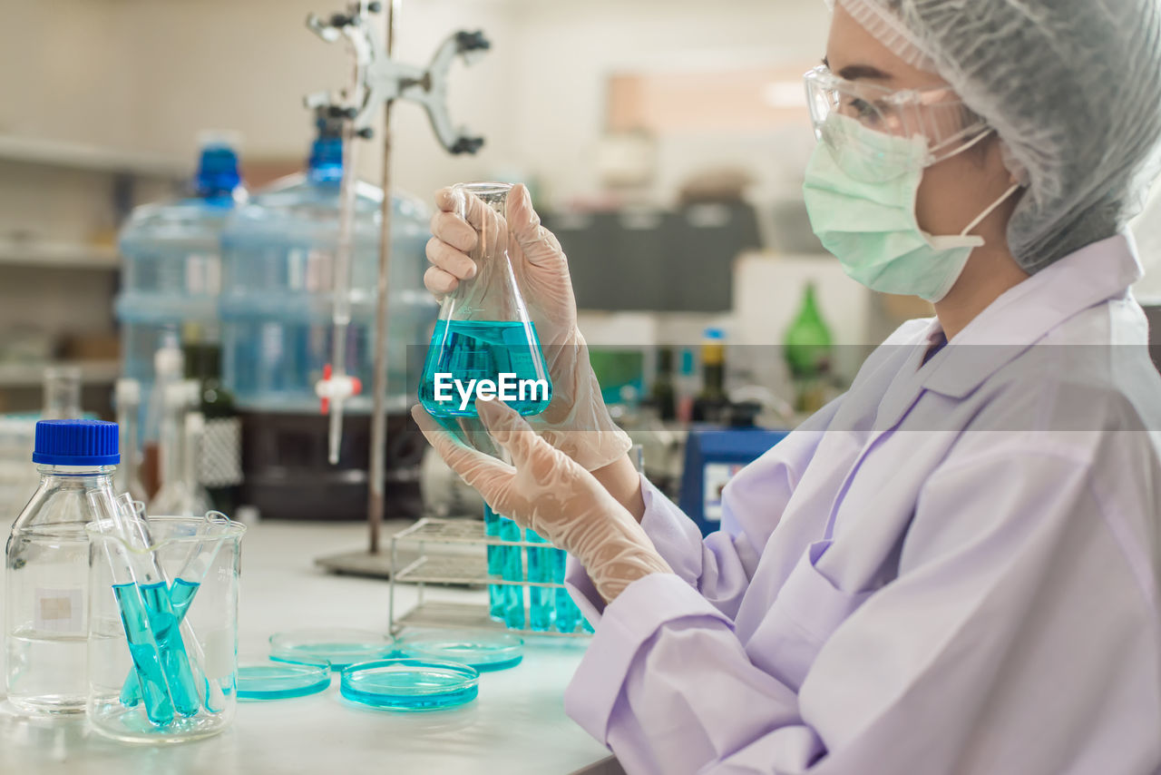 Scientist working at table in laboratory