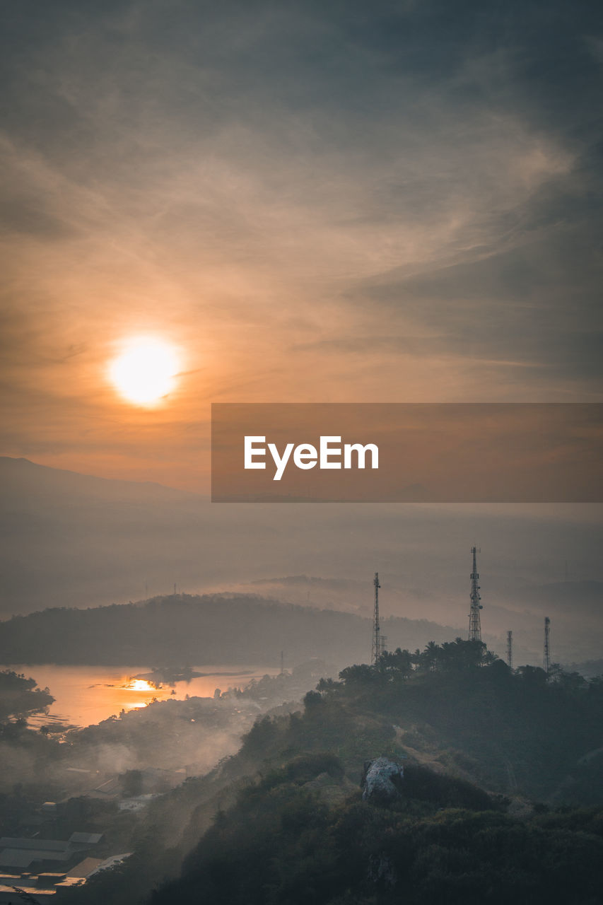 Scenic view of mountains against sky during sunset