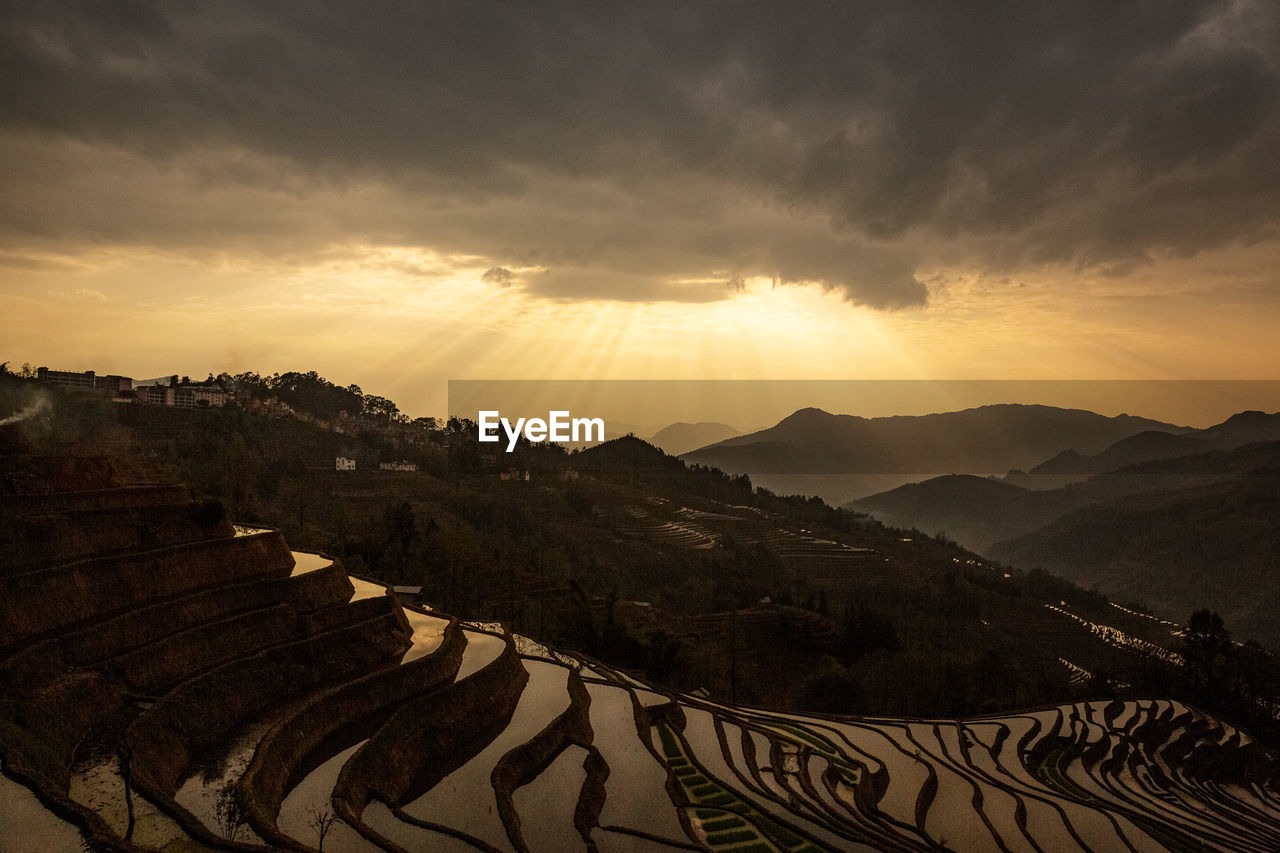 Scenic view of mountains against sky during sunset