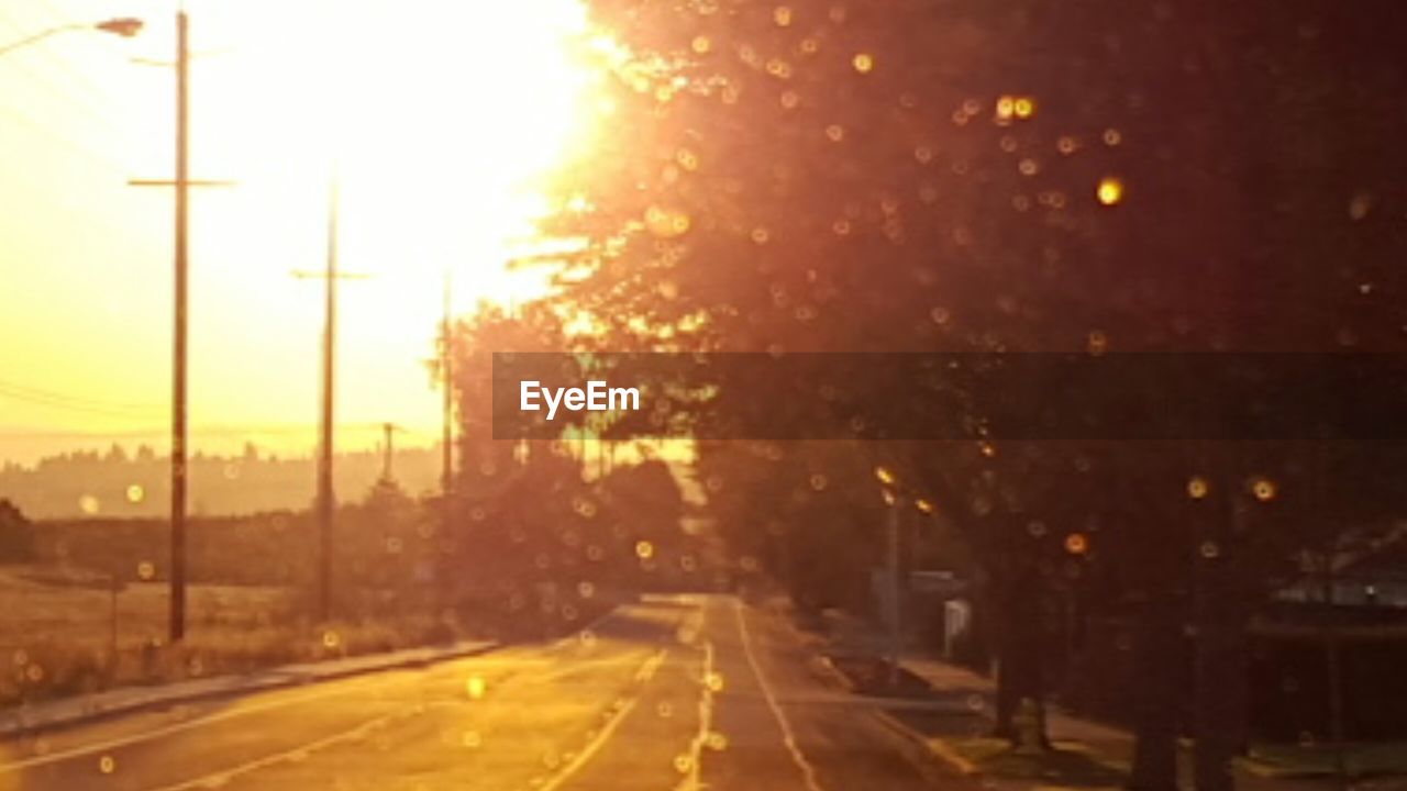 ROAD PASSING THROUGH CITY AT SUNSET