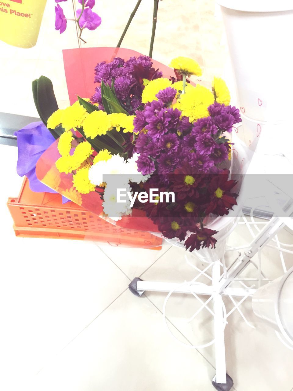 CLOSE-UP OF VASE ON TABLE