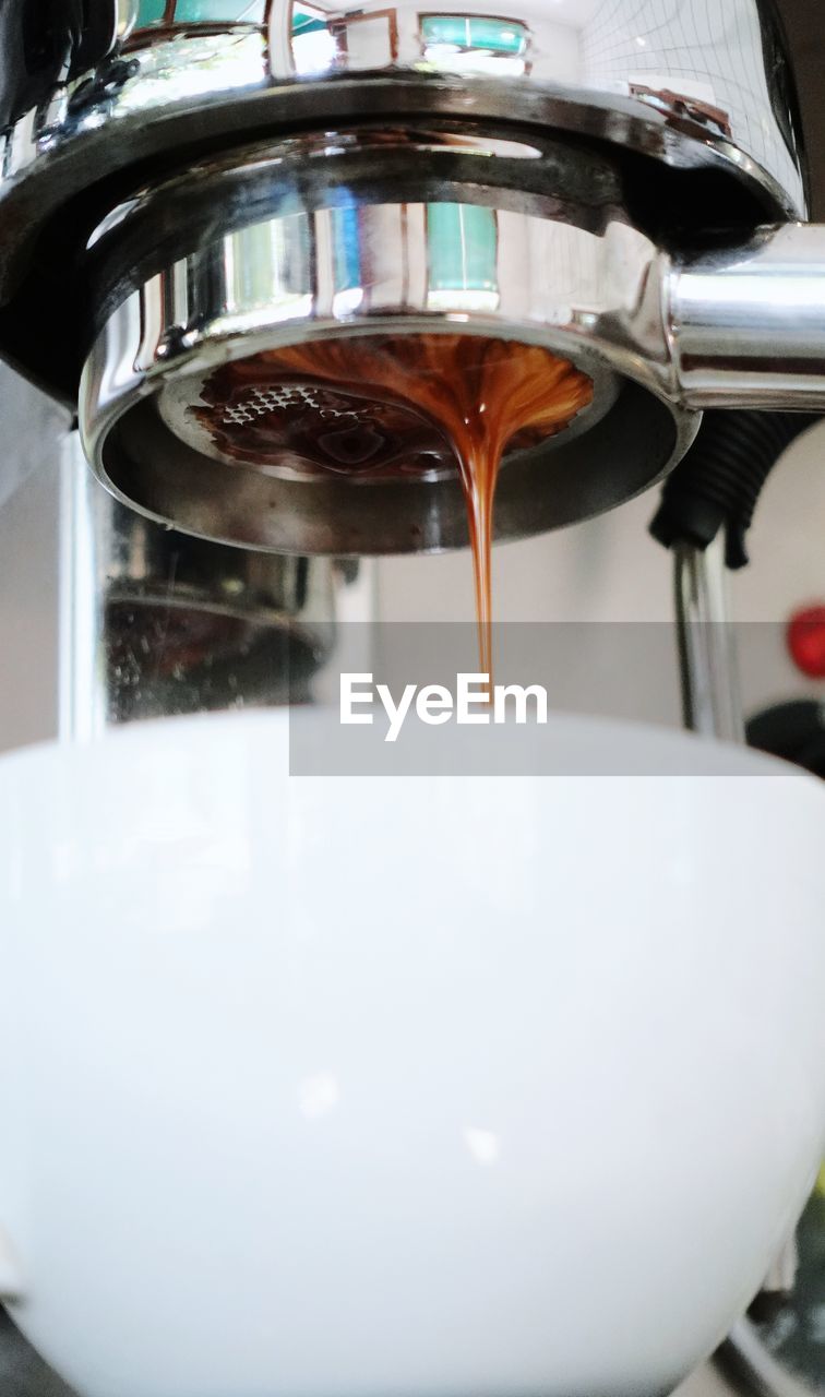 food and drink, pouring, indoors, drink, coffee, coffeemaker, close-up, espresso machine, household equipment, refreshment, appliance, water, food, espresso maker, freshness, machinery, motion, metal, domestic room, home, making, no people, kitchen
