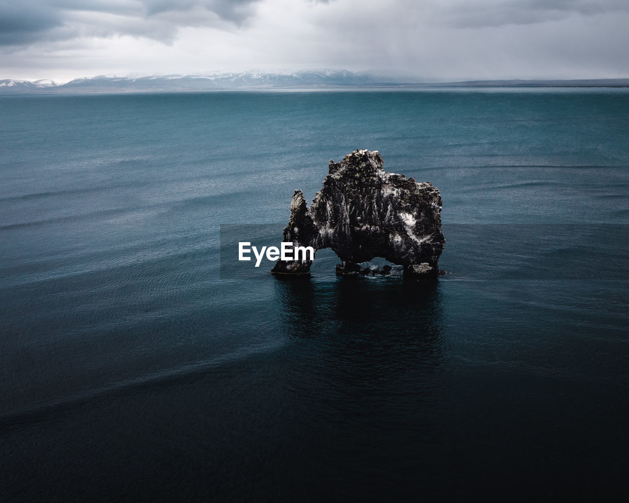 View of rock formation in sea