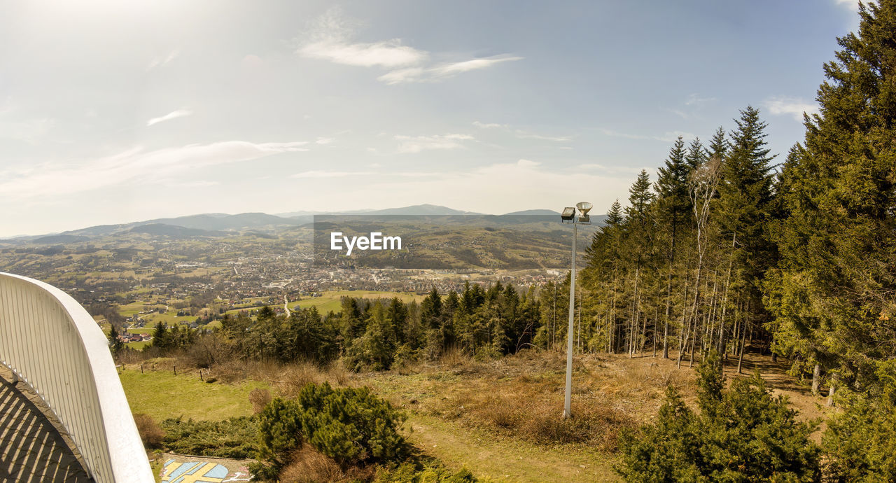 Limanowa, poland wide angle of from miejska gora view point showing polish mountain range  and trees