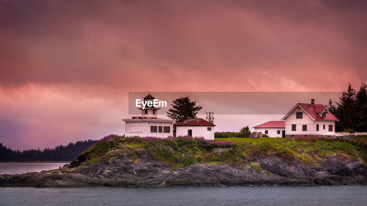 BUILDING BY SEA AGAINST SKY