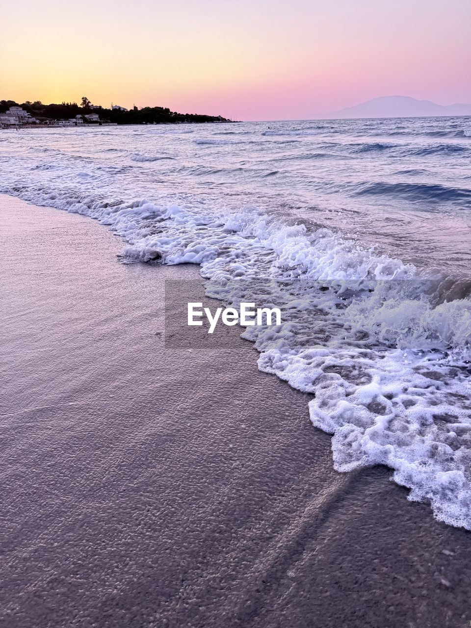 land, sea, water, sunset, beach, sky, shore, beauty in nature, scenics - nature, wind wave, wave, ocean, body of water, nature, sand, horizon, coast, environment, tranquility, landscape, motion, tranquil scene, surfing, water sports, sports, dusk, travel destinations, idyllic, ice, sun, horizon over water, outdoors, dramatic sky, travel, winter, coastline, cloud, seascape, water's edge, non-urban scene, sunlight, twilight, tide, tourism, reflection, blue, cold temperature