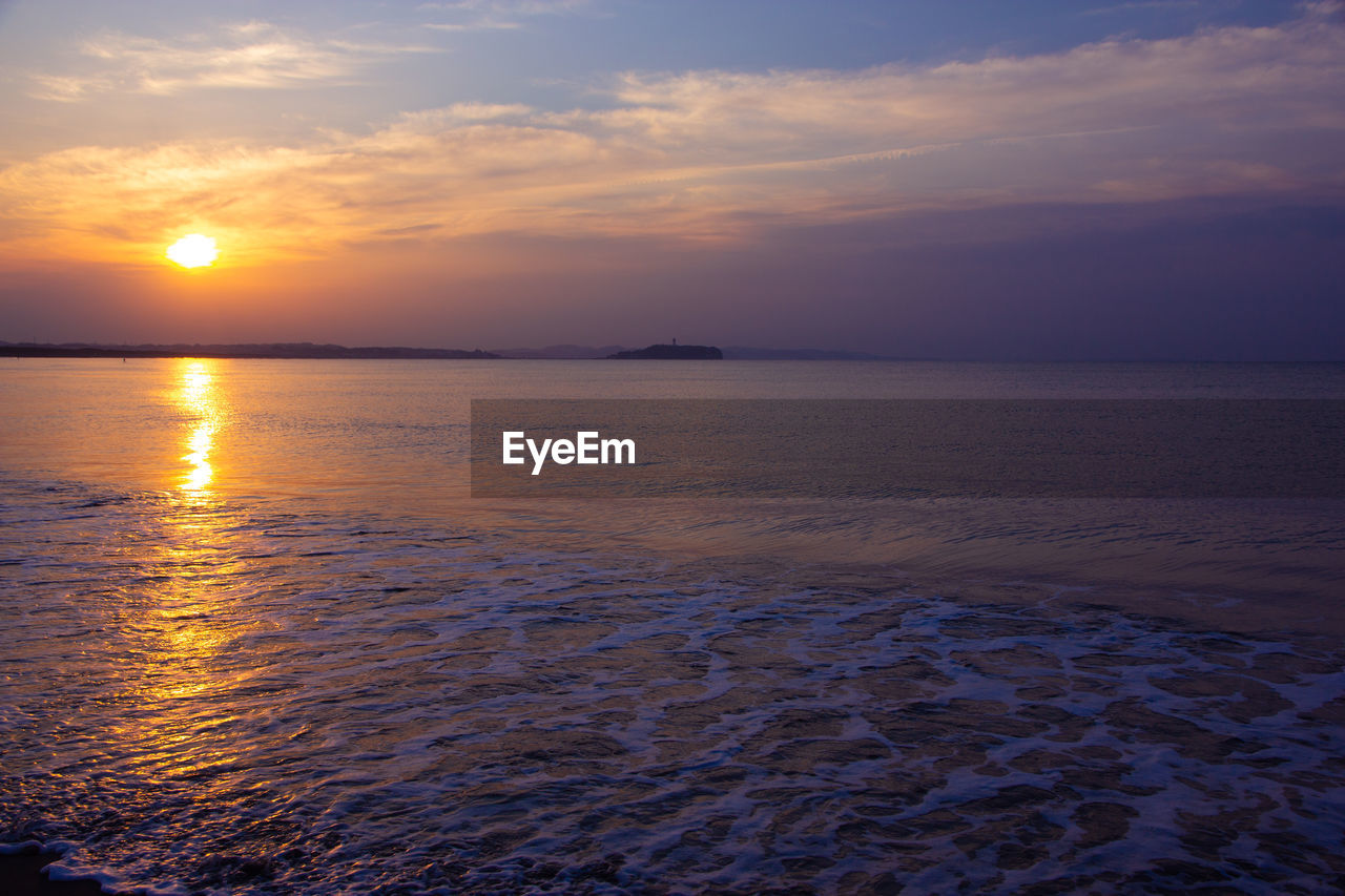 Scenic view of sea against sky during sunset