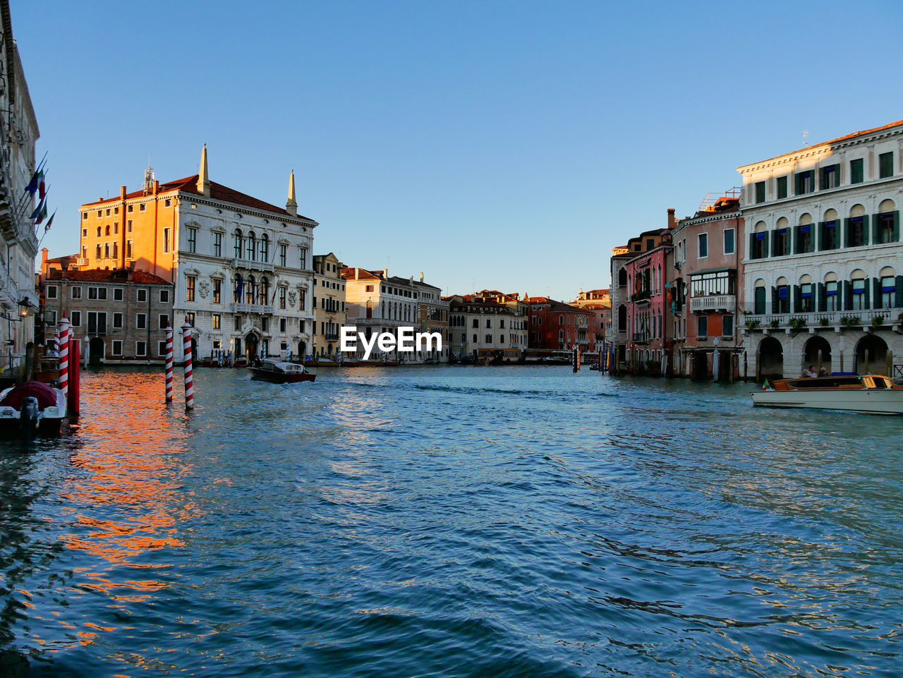 Canal passing through city buildings