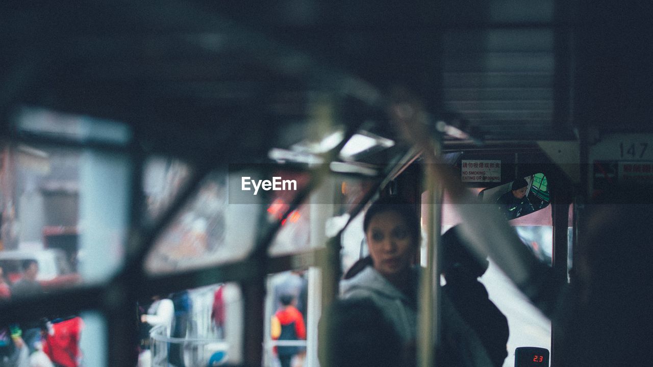 CLOSE-UP OF A MAN IN A BUS