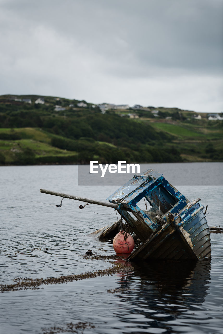 ABANDONED BOAT IN SEA