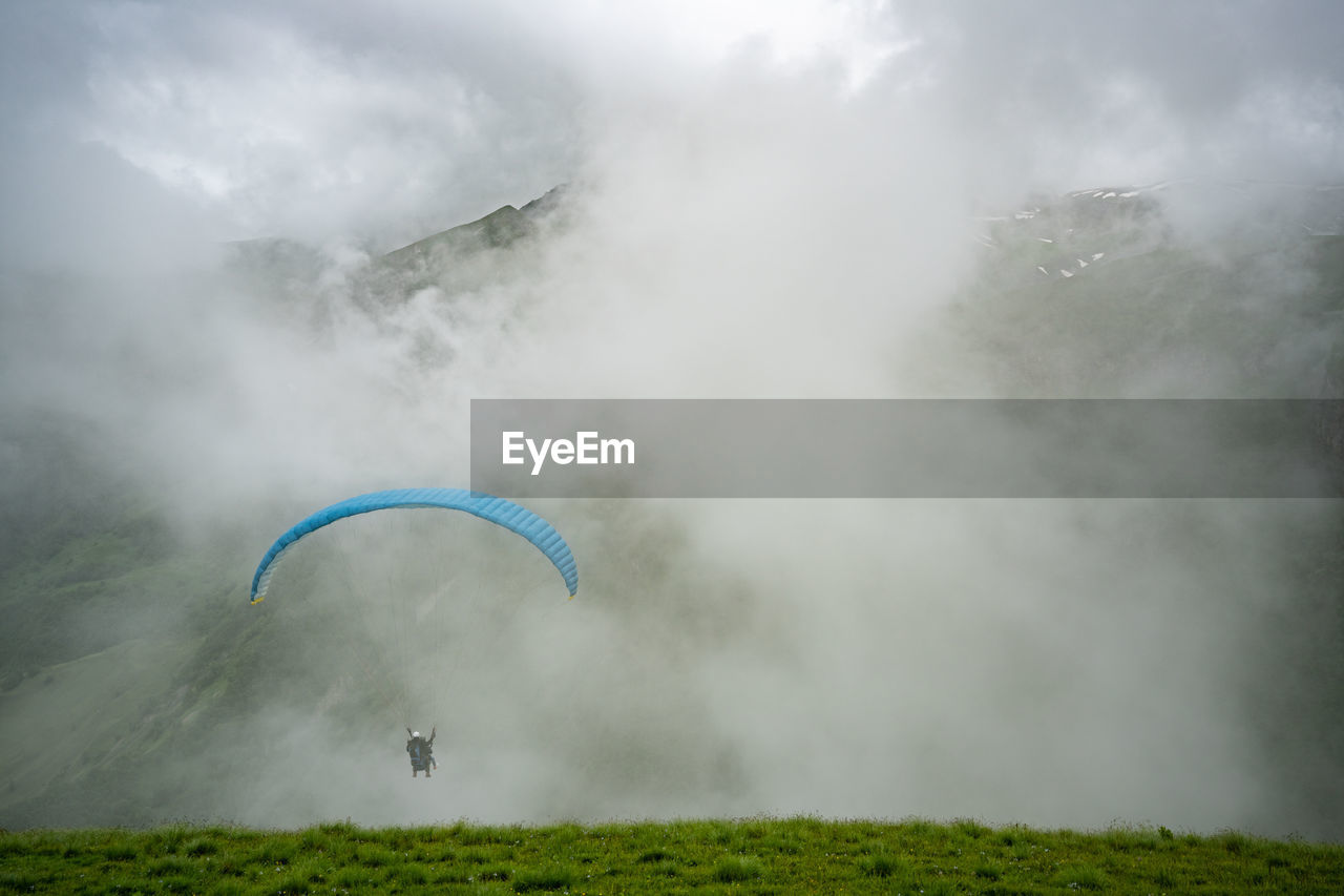 Parachute on field during foggy weather