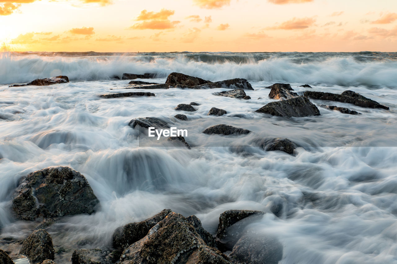 Scenic view of sea against sky at sunset