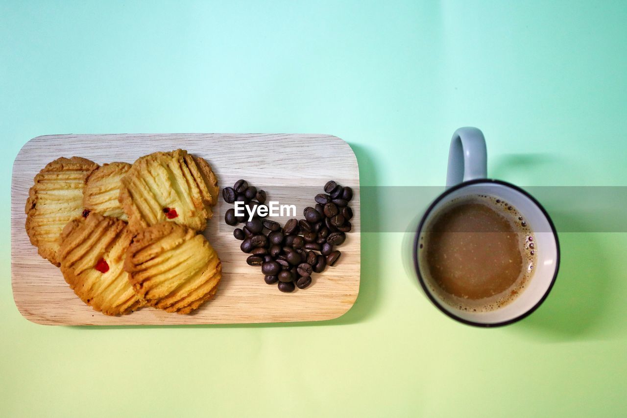 HIGH ANGLE VIEW OF COFFEE AND COOKIES