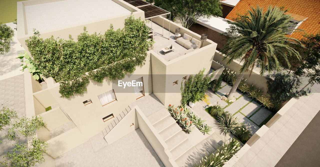 plant, architecture, building exterior, tree, built structure, building, home, courtyard, residential district, nature, condominium, estate, residential area, high angle view, tropical climate, house, palm tree, growth, neighbourhood, city, outdoors, no people, day, home ownership, mansion, sunlight, facade, front or back yard, green, luxury