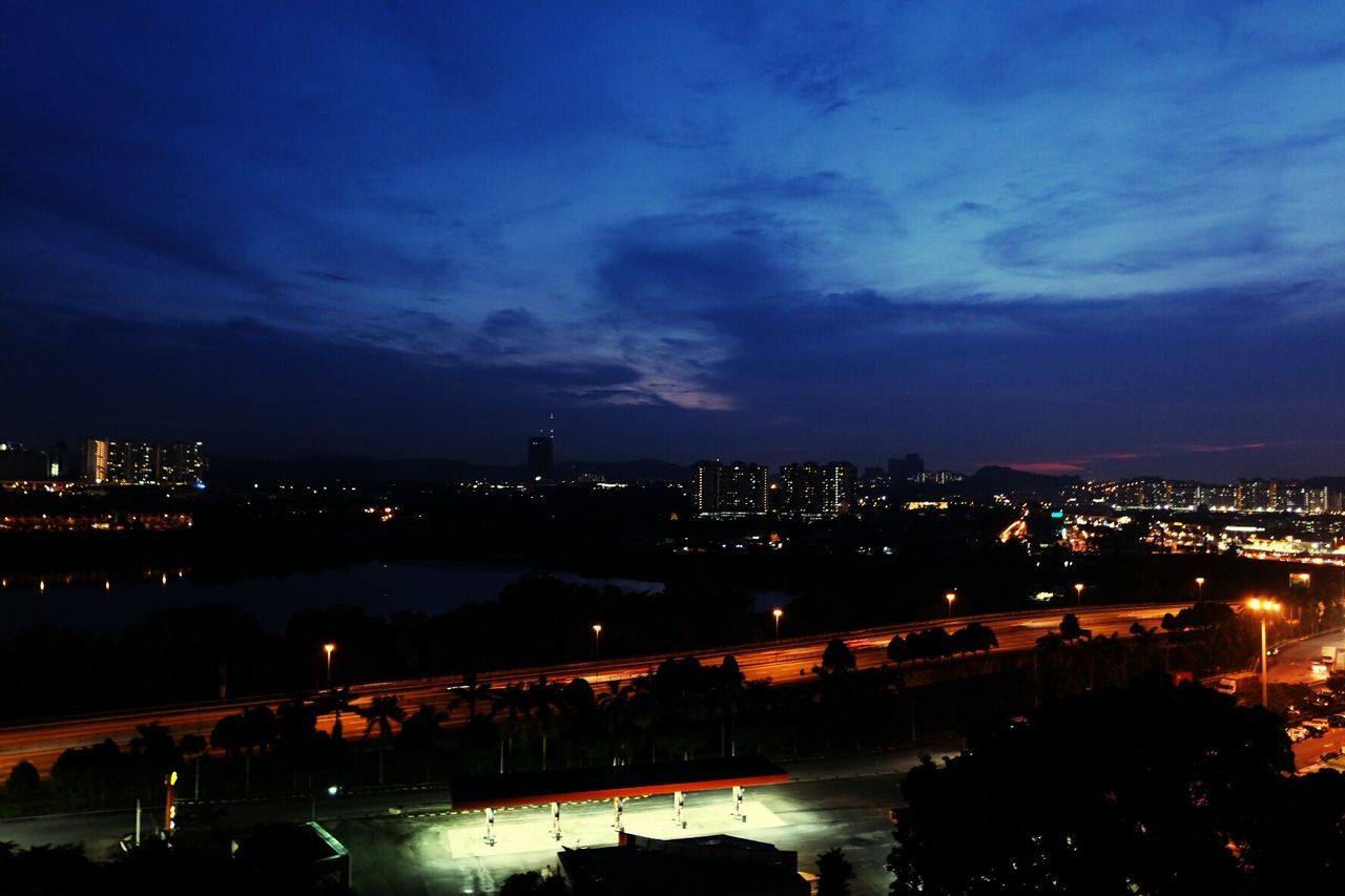 VIEW OF ILLUMINATED CITYSCAPE