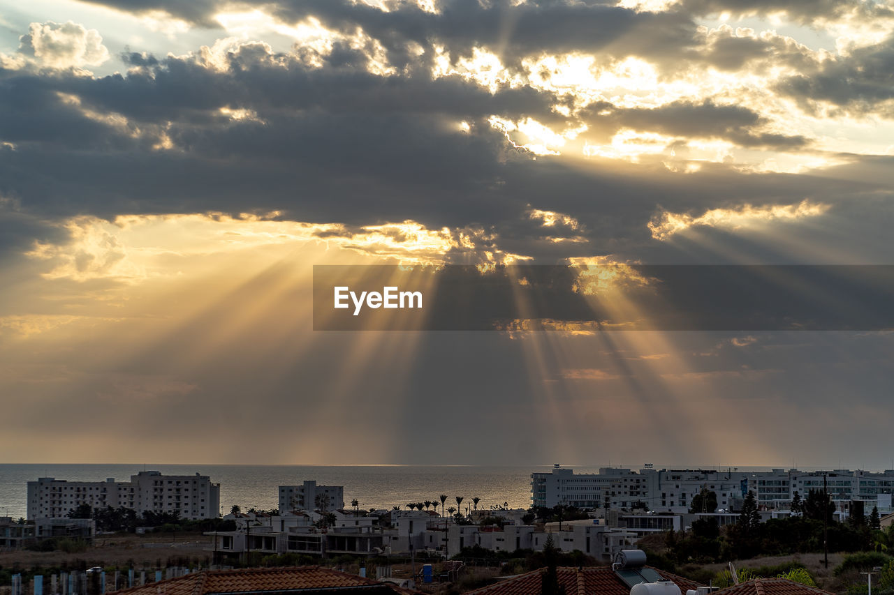 High angle view of buildings against sky during sunset