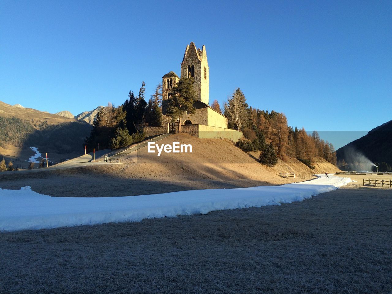 VIEW OF MOUNTAIN AGAINST CLEAR BLUE SKY