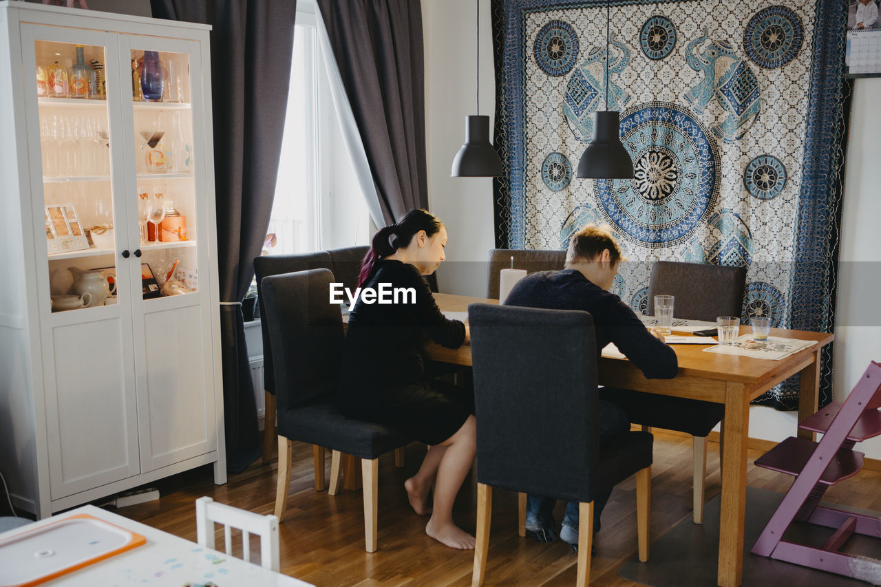 Couple sitting at dining table