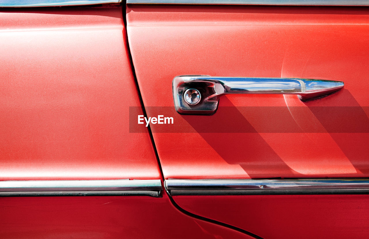 Detail of vintage red car door