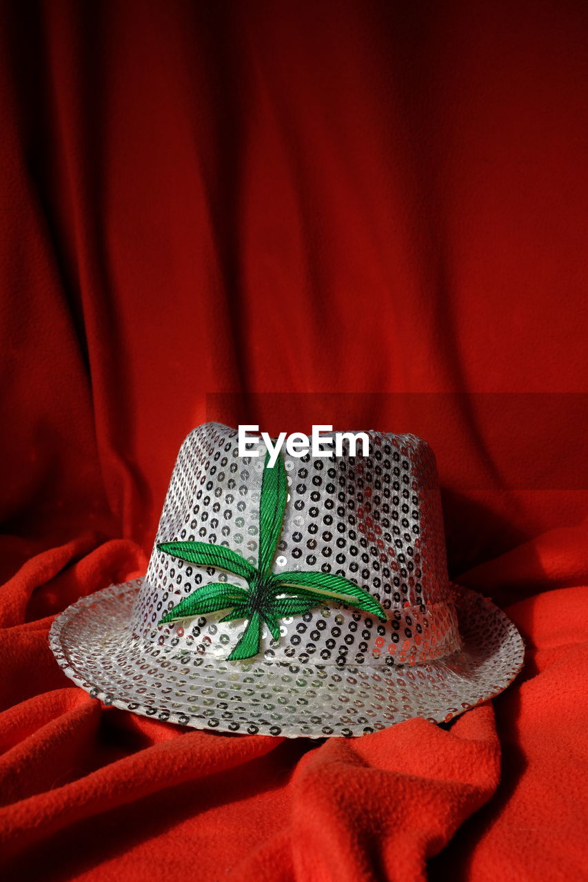 White hat on red textile