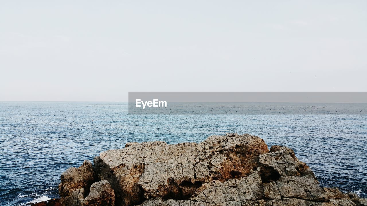 Scenic view of sea against clear sky