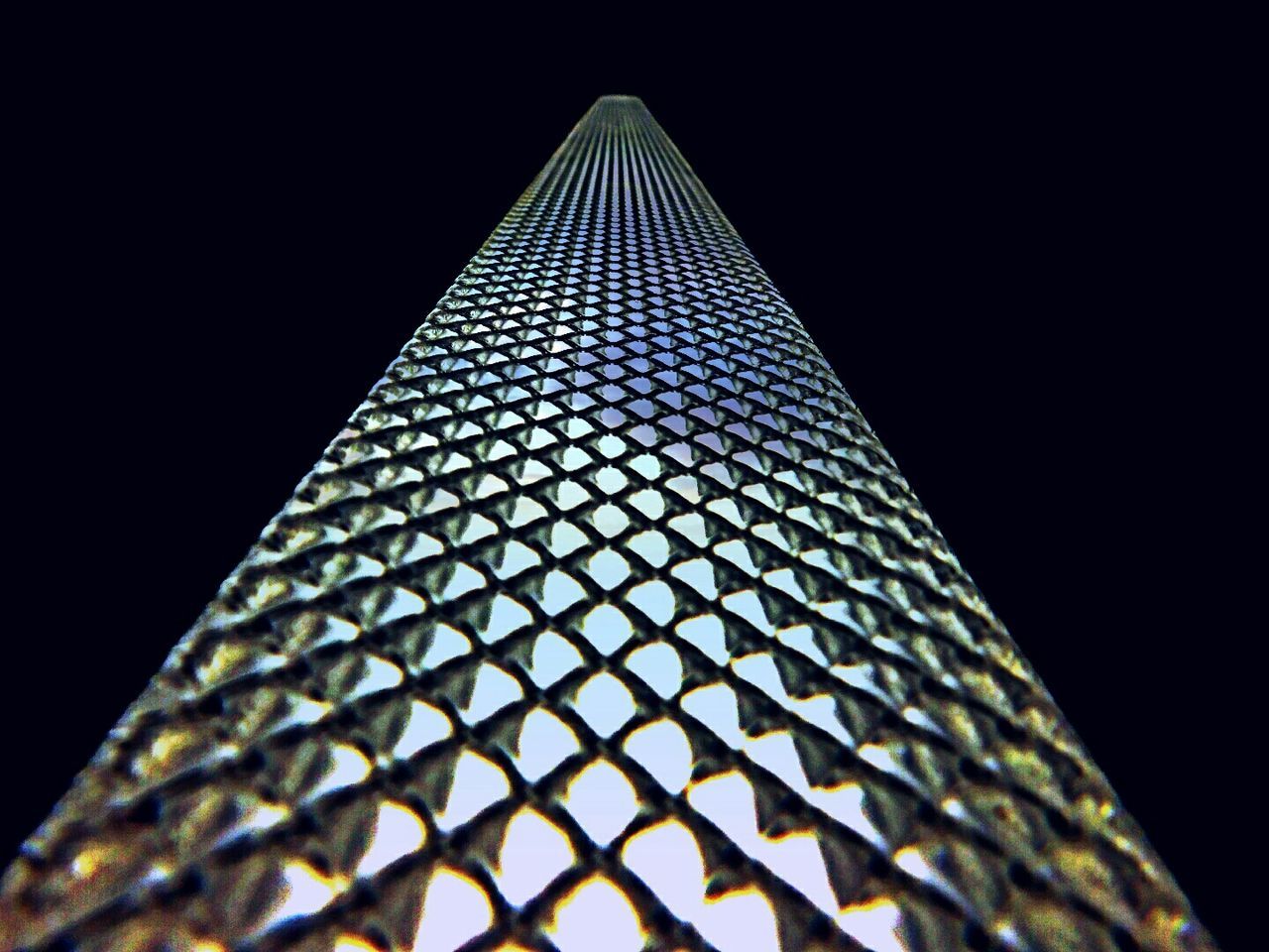 LOW ANGLE VIEW OF ILLUMINATED SKYSCRAPER