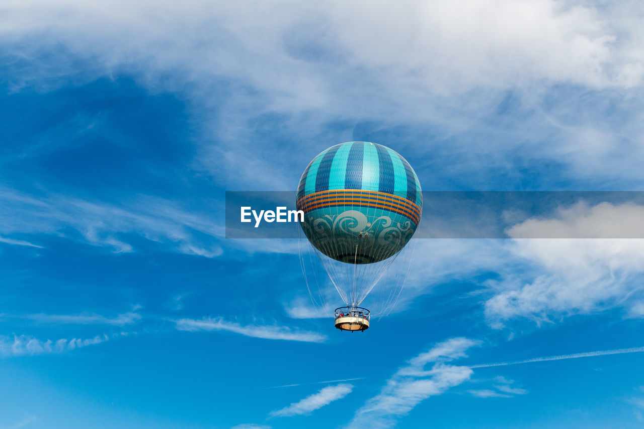 Low angle view of hot air balloon against blue sky