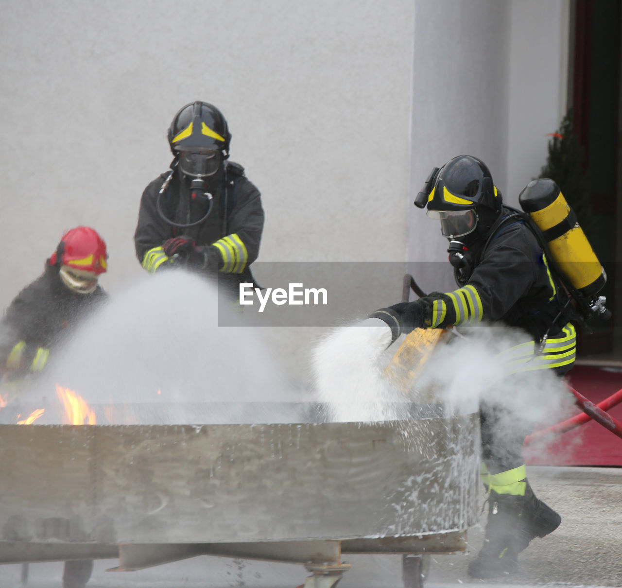 Firefighters extinguishing fire