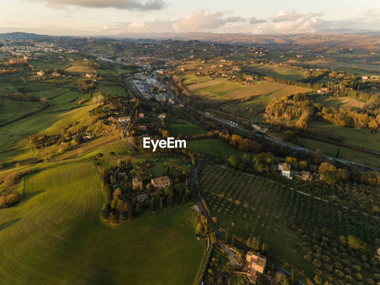 High angle view of buildings on field against sky
