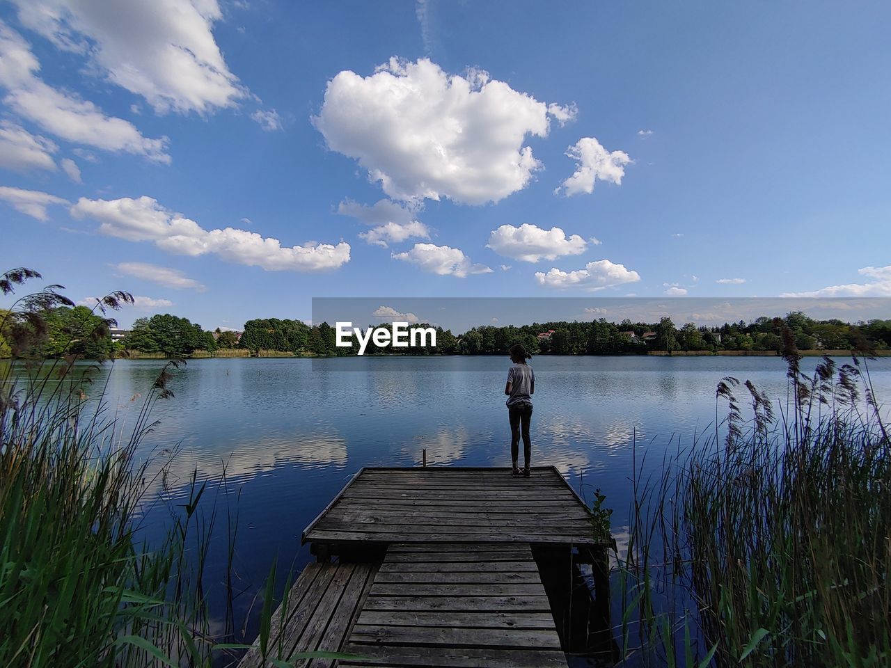 Pier on lake against sky